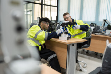 Assembling Robotic Arm. Engineer training and test programmable logic controller with AI robot training kit and mechatronics engineering in worksh © amorn