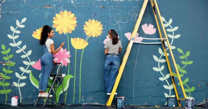 Wall, mural painting and women with ladder, community project and artist with cooperation. Volunteer, outdoor and friends with creativity, expression and diy decor with flowers, student and hobby