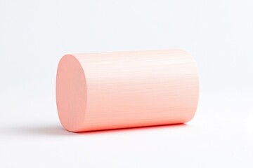 Obraz premium Pale peach cylinder on white background