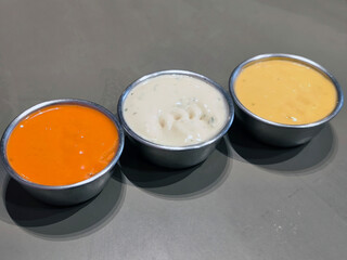 close up. Three Dipping sauce cup with condiments 