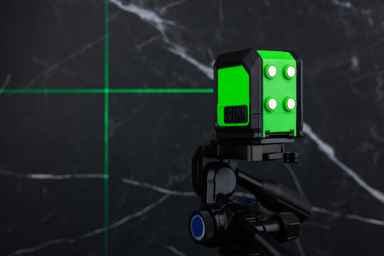 Construction laser level in a building under construction. Laser equipment at a construction site