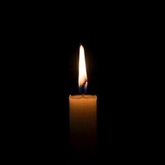 Single Candle Flame Burning Brightly in the Darkness. burning candle on black background