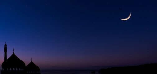 Ramadan Night background,Mosque dome silhouette on dusk sky with crescent moon,star,Banner sunset...