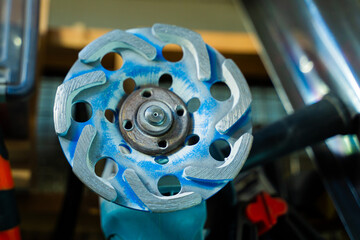 Blue concrete grinding attachment close-up