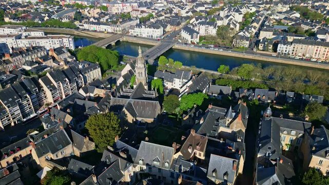 Amazing drone shot about the Saint Benoit church of Le Mans and Pont Perrin and Sarthe River weaving through the town of Le Mans, France.