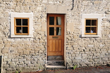Exterior of a beautiful old house on a street in an English village