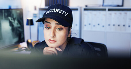 CCTV, security and thinking with woman in office at night for law enforcement, monitoring or...