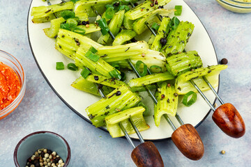 Vegetable celery skewers arrayed on a platter.