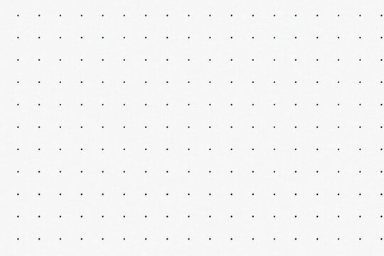 Minimal clean dotted paper background with tiny black holes on white surface. design mockups printing templates office or school stationery layout