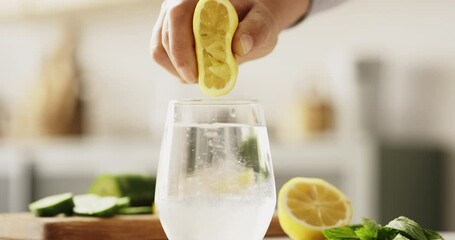 Squeezing lemon into drinking water