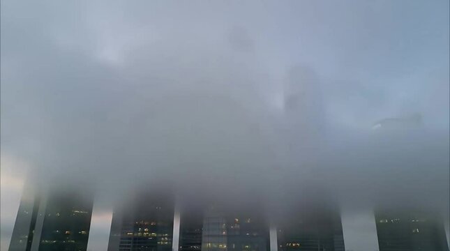 Fog Covering Tall Buildings &ndash; Atmospheric City Time-Lapse