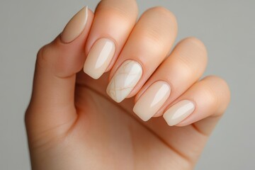 Hand with beige manicure and square shaped nails