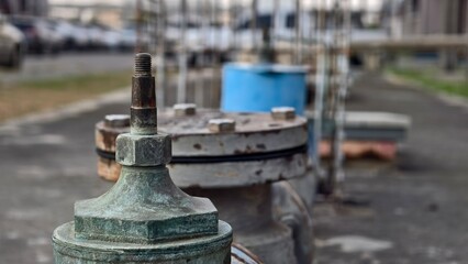 Fototapeta premium Industrial Valves and Fittings in Urban Setting