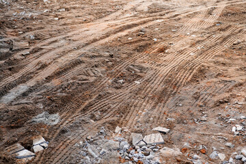Tire Tracks on Brown Dirt Ground, Construction Site, Heavy Machinery Traces