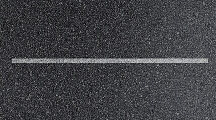 Fototapeta premium Close-up of textured asphalt road with single white line for transportation concept