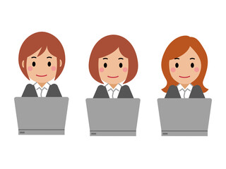 パソコンを操作するグレースーツの若い女性