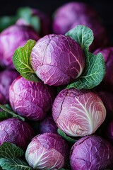Close-up of vibrant purple cabbages with fresh green leaves