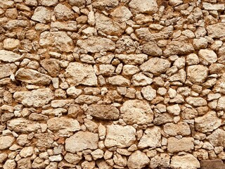 Background of ancient stone wall. Texture of old brick.