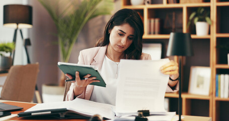 Woman, tablet and paperwork in office for business, contract review and case study in law firm....