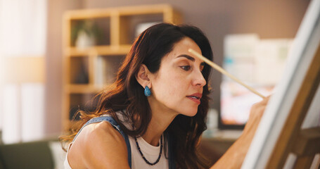 Artist, woman and painting in home for inspiration, art or design process for project in lounge....