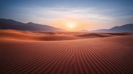 Fototapeta premium Stunning Sunset Over Rolling Sand Dunes in a Vast Desert Landscape