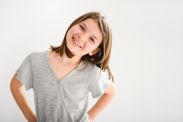 Portrait of a cute 8 years old girl over white background