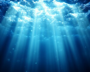 Sunbeams pierce deep ocean, illuminating clouds above
