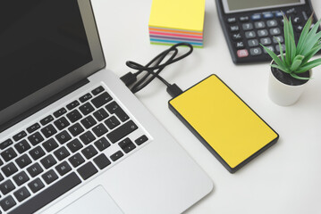 External hard disk connected to laptop.