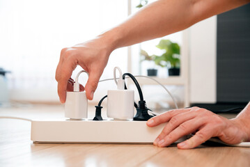 Electrical plug in outlet socket at home