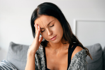 Woman has a headache, depression concept