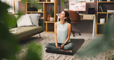 Phone, thinking and woman with earphones, zen and listening to sound for self awareness in home....