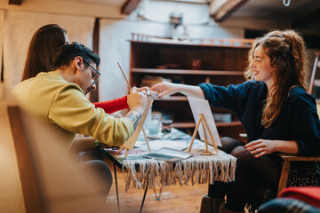 Friends gather around a table to draw and paint in a creative session. The cozy ambiance fosters...