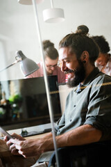 Leadership, tablet and hipster startup programmer CEO or manager in the office. Technology planning.