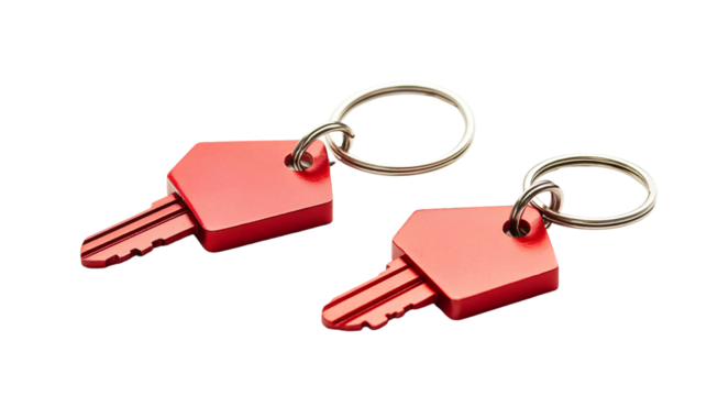 Stylish House Key Pair with Red House-Shaped Keyring Isolated