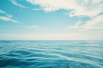 Fototapeta premium Endless horizon meets tranquil waves under an expansive azure sky, evoking a sense of peace and infinity.