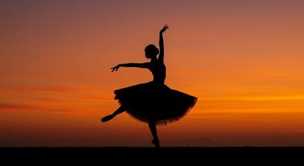 Ballet dancer silhouette against sunset sky dancing gracefully in elegant pose