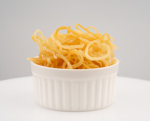 Beer snack made of dried squid. Dried squid isolated on white background. Dried squid shavings. Small fish, shrimp and squid that have been marinated with salt and dried