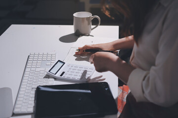 Expert woman asian female people review data number costing managerial account prepare monthly...