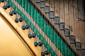 Old piano strings close up. Stringed musical instrument, sound, tuning, music concept