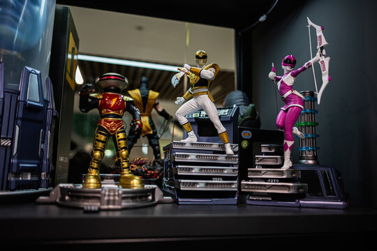 Action figures of iconic Power Rangers heroes displayed in a collector's showcase
