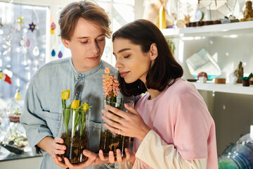 Creative duo sharing inspiration in an art studio filled with botanical beauty and vibrant colors