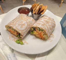 Spicy Salmon wrap on the table in a dining room 