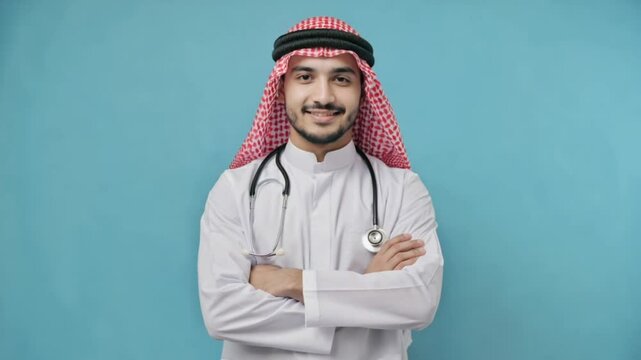 A smiling young male doctor in a professional coat with a stethoscope represents healthcare