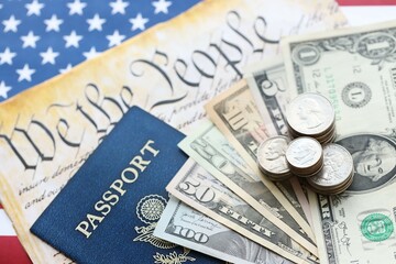 American US dollars money bills and passport with american flag