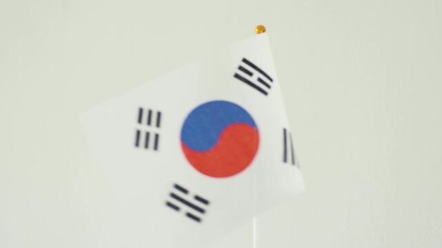 Closeup of a flag of South Corea. Corean culture and corean language concept.