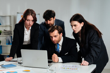 Team Collaboration and Focus on Business Project in Office Setting