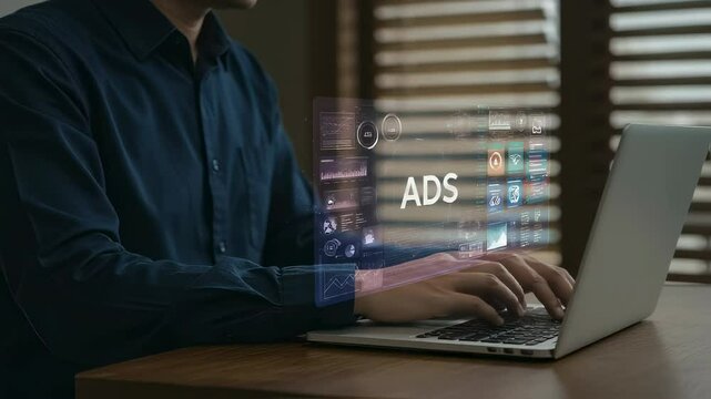 Looking up advertisements on a laptop. Image of considering marketing and advertising methods(Loop playback possible)