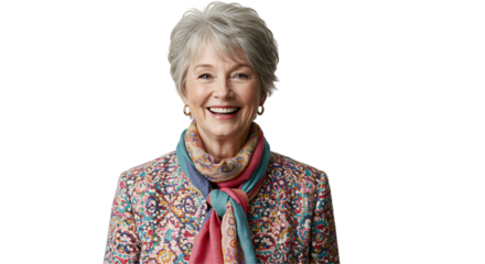 Portrait of a cheerful older Caucasian woman with short grey hair, smiling brightly and wearing a vibrant patterned jacket and colorful scarf.