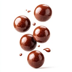 Obraz premium Delightful milk chocolate balls playfully falling into the air captured in artistic style isolated on a white background