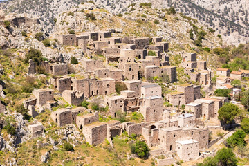 Abandoned Greek ghost town Anavatos with stone buildings on Chios island in Greece, Aerial view